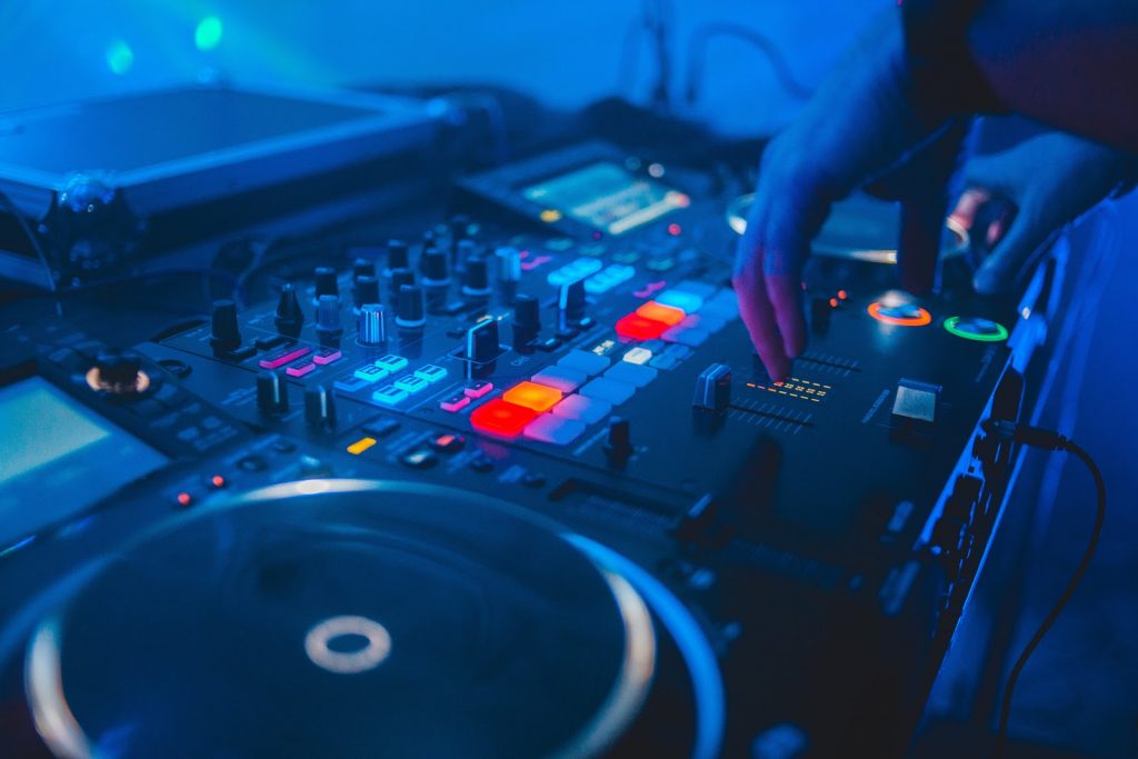 https://www.pexels.com/photo/person-playing-dj-mixer-with-blue-lights-4062563/